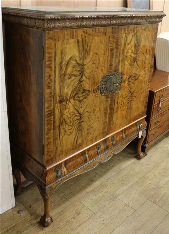 A 1920s George I style cabinet W.127cm